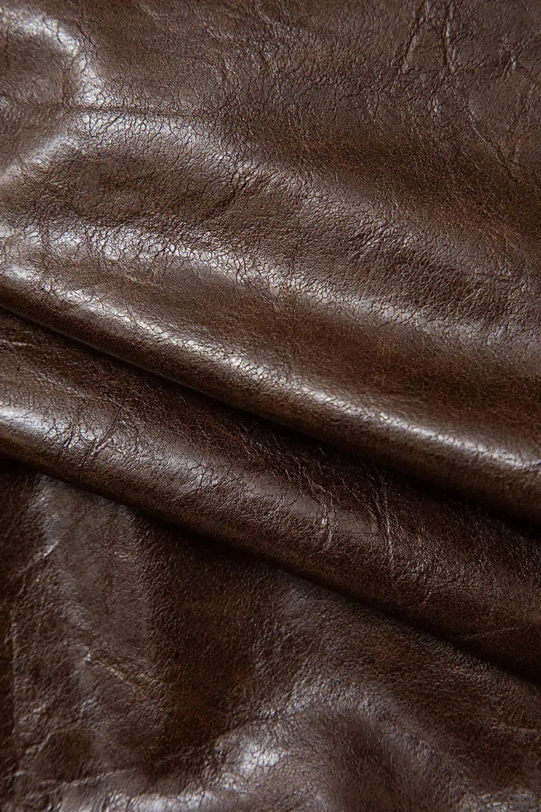 Rita – Bold hemline – Asymmetrical faux leather mini skirt